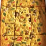 Delicious Breakfast Casserole with eggs, sausage, cheese, and hash browns for brunch.