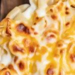 Creamy Baked Mac and Cheese with a crunchy topping and layers of cheese.