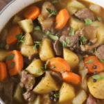 Hearty Beef Stew with tender beef, carrots, potatoes, and rich broth.