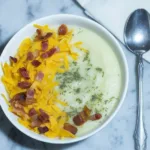 Quick and easy potato soup made from canned potatoes served in a bowl.
