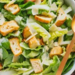 Classic Caesar Salad with romaine lettuce, croutons, and creamy dressing.