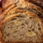Freshly baked banana bread with a golden crust and a moist interior