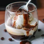 Delicious affogato dessert with espresso poured over vanilla ice cream.