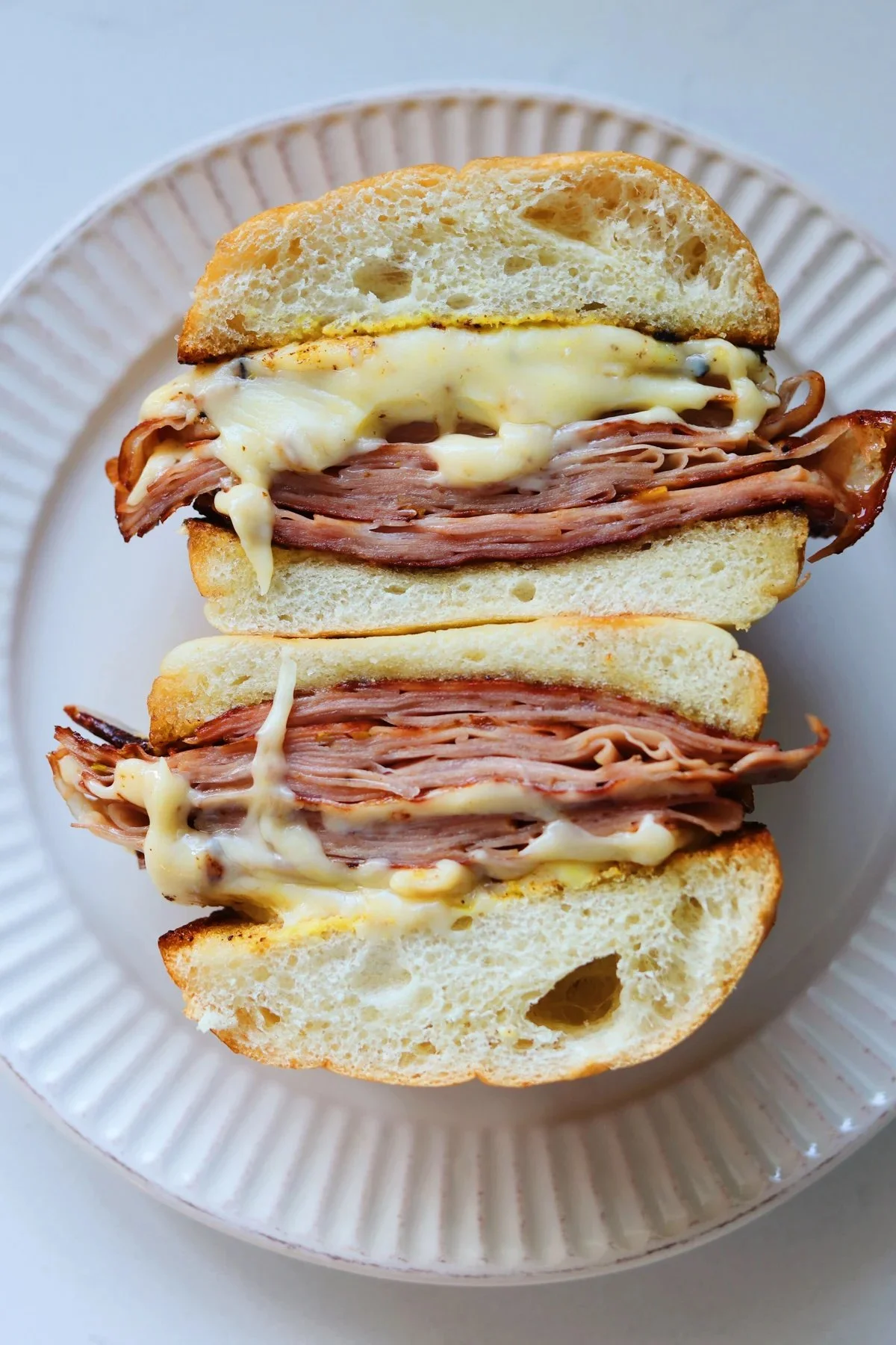 Bourdain's delicious mortadella sandwich, highlighting rich flavors and quality ingredients.