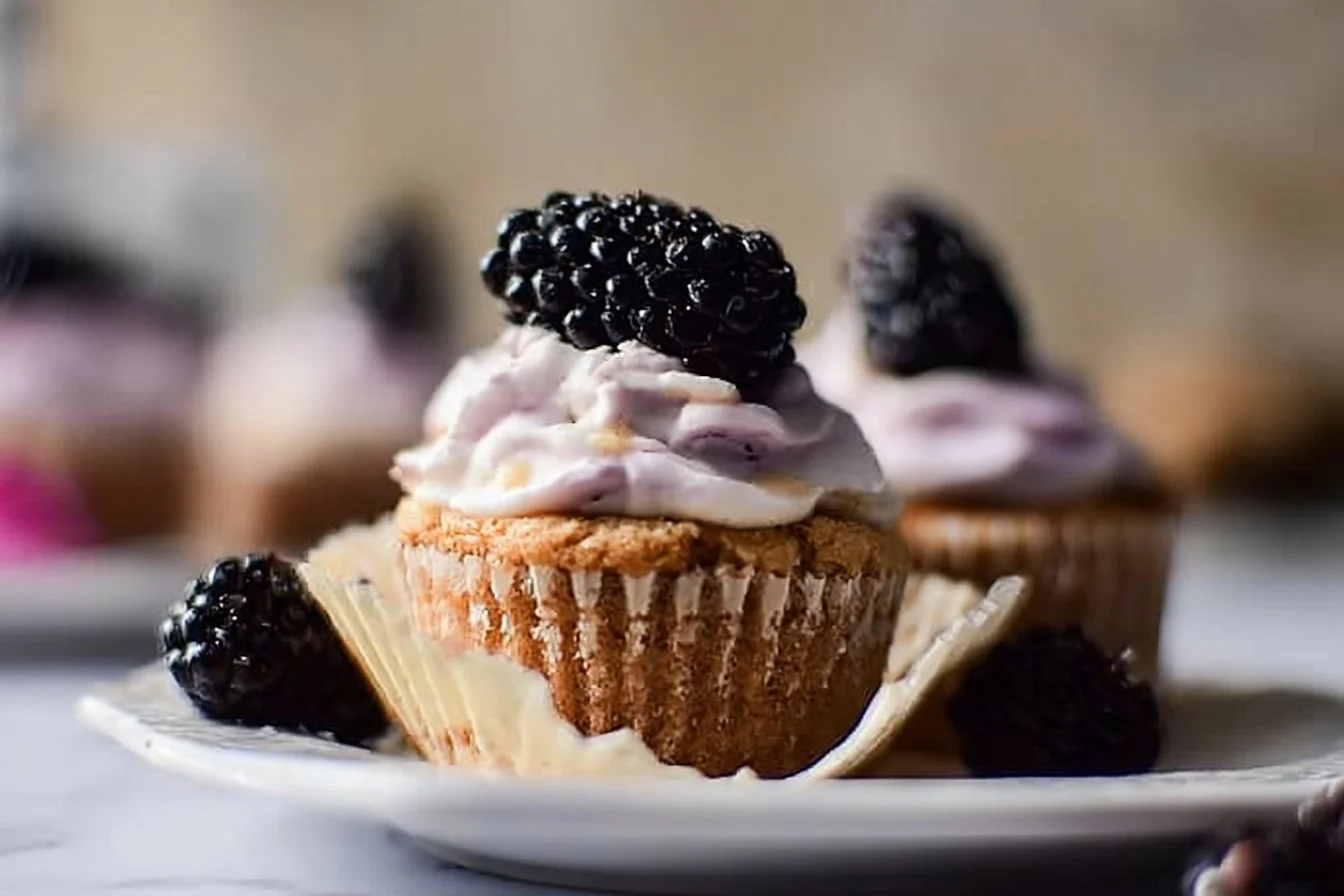 Delicious Blackberry Earl Grey Cupcakes topped with creamy frosting