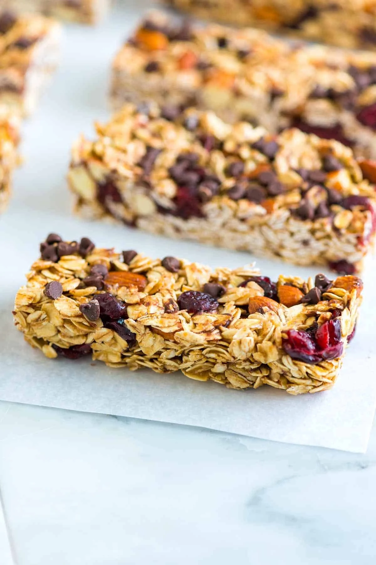 Soft and chewy granola bars stacked with nuts and dried fruits
