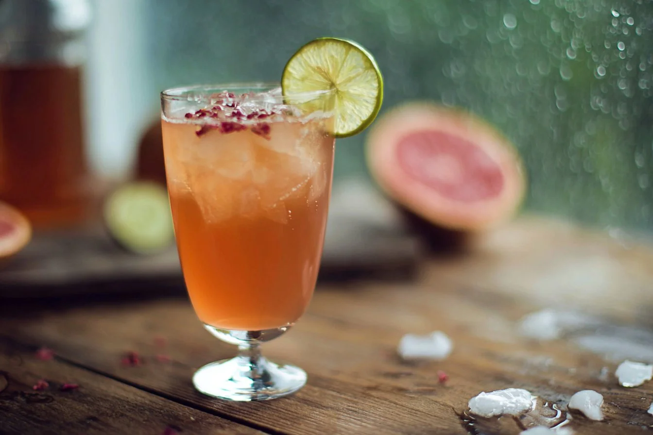 April Showers cocktail with colorful garnishes and a refreshing look.
