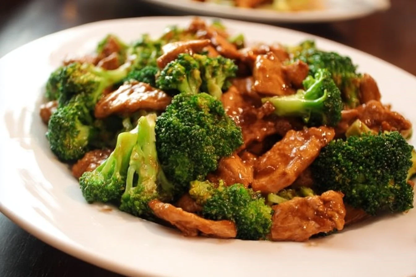 Plate of Chinese Chicken and Broccoli dish with vibrant colors and flavors