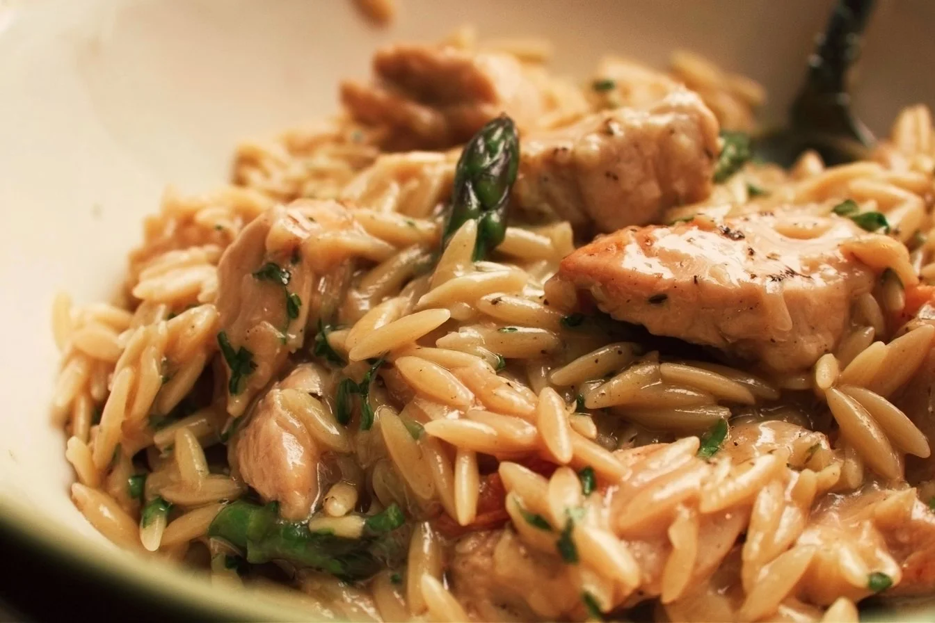 High protein chicken orzo dish served in a bowl