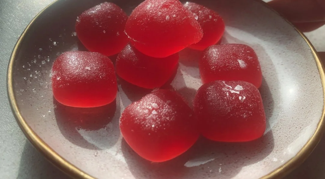 Sour watermelon gummy sweets in vibrant green and pink colors